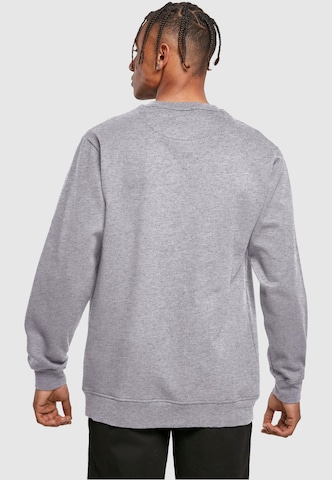 Merchcode Sweatshirt 'Peanuts Chasing Snowflakes' in Grau