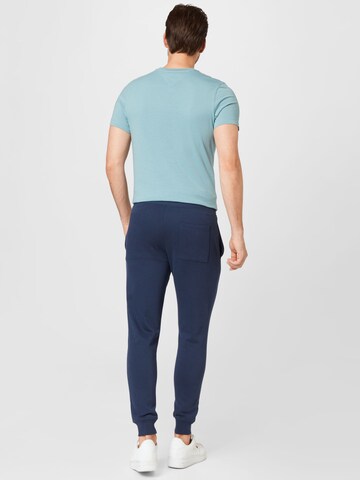 Tommy Jeans Tapered Hose in Blau