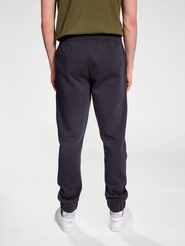 Effilé Pantalon de sport Hummel en noir