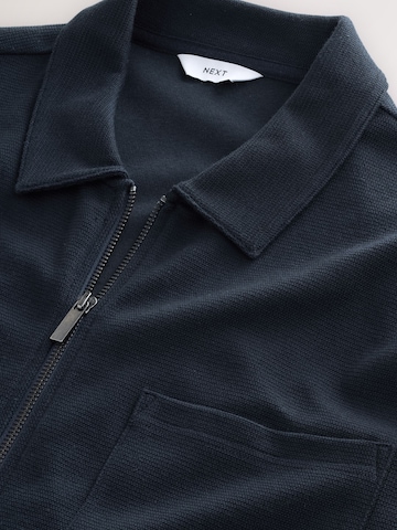 Next Tussenjas in Blauw