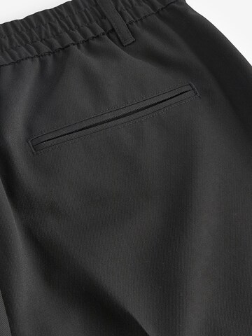 Loosefit Pantaloni chino di Next in nero