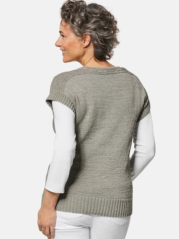 Goldner Strickweste in Grün