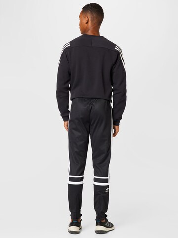 Tapered Pantaloni 'Adicolor Classics Cutline' de la ADIDAS ORIGINALS pe negru