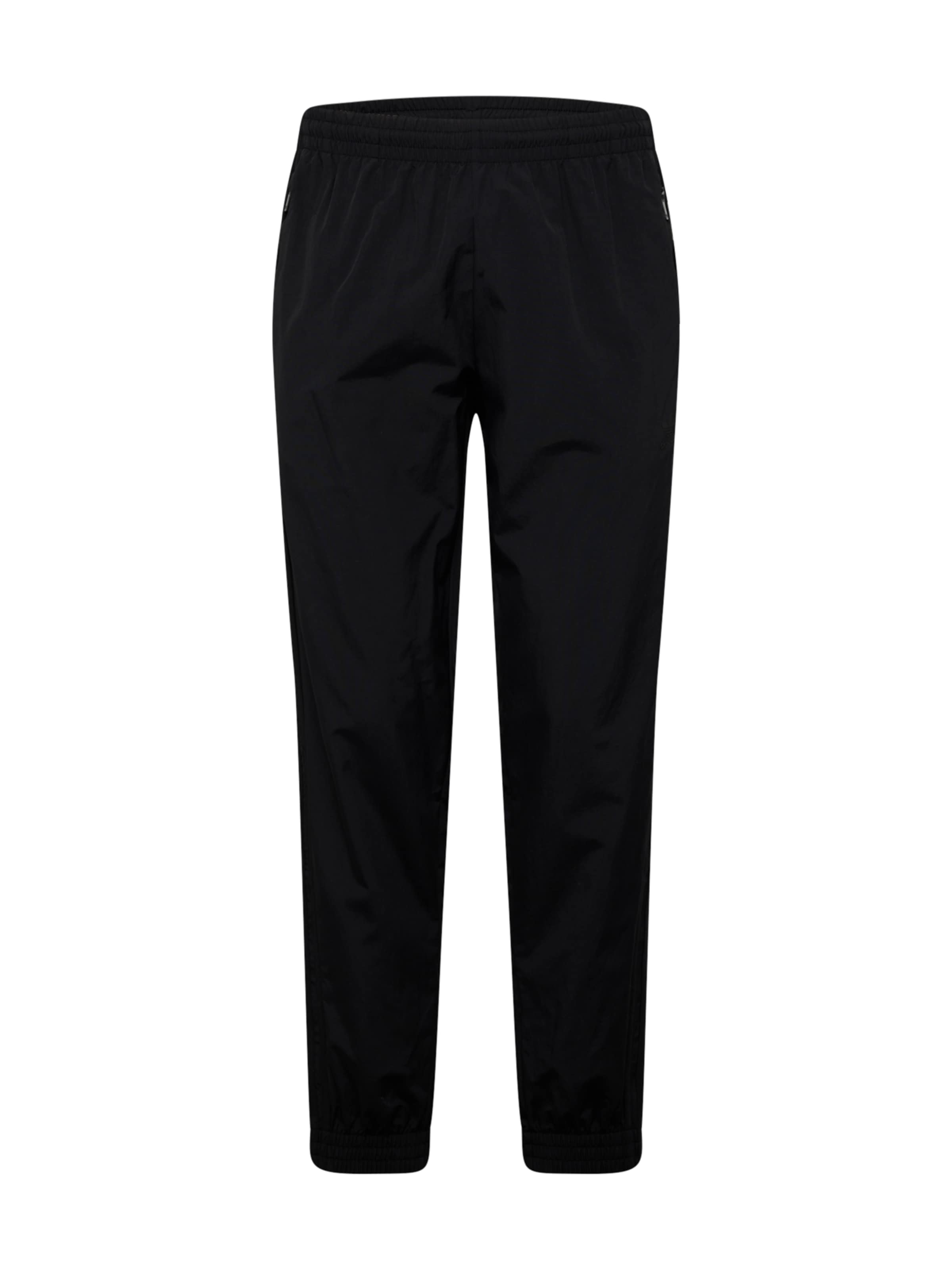 Tapered Pantaloni di ADIDAS ORIGINALS in nero: frontale