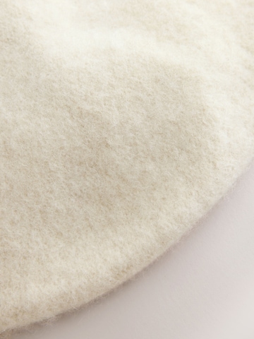 Next Pipo värissä beige