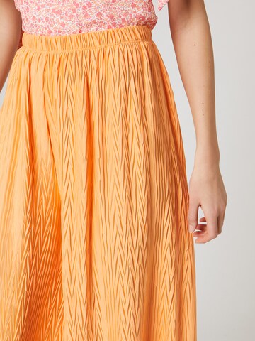 ABOUT YOU x Laura Giurcanu Loose fit Trousers 'Christin' in Orange