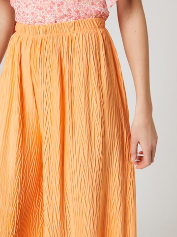 ABOUT YOU x Laura Giurcanu Loose fit Trousers 'Christin' in Orange