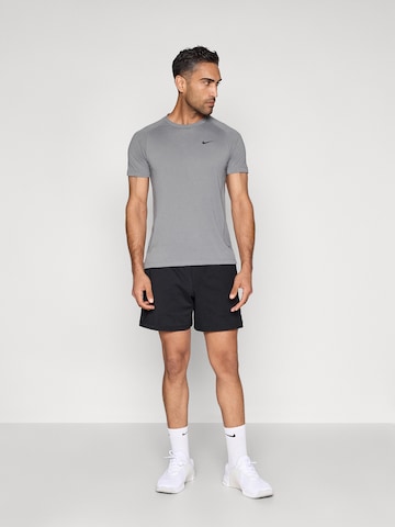 NIKE Loosefit Sportsbukser 'PRMRY NANO' i sort