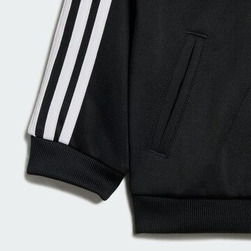 ADIDAS ORIGINALS Jogginganzug 'Firebird' in Schwarz