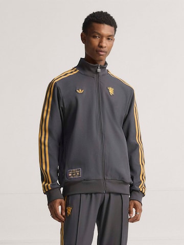 ADIDAS ORIGINALS - Sudadera con cremallera deportiva 'Manchester United Terrace Icons' en negro: frente