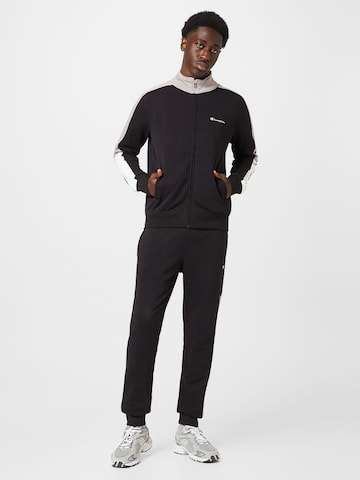 Champion Authentic Athletic Apparel Tracksuit in Black: front