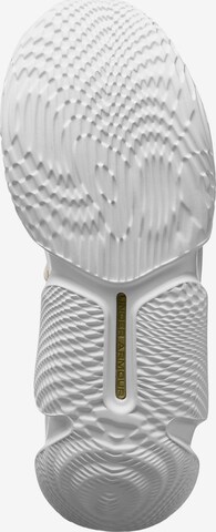 Scarpa sportiva 'Flow FUTR X 3' di UNDER ARMOUR in bianco