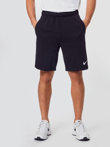 Regular Pantaloni sport de la NIKE pe negru: față