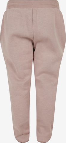 Tapered Pantaloni di Urban Classics in rosa