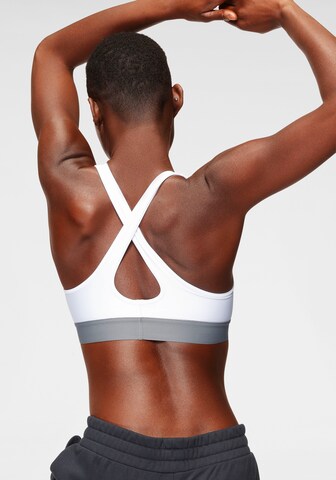 Bustier Soutien-gorge de sport UNDER ARMOUR en blanc