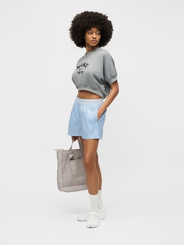 Largi Pantaloni de la Nike Sportswear pe albastru