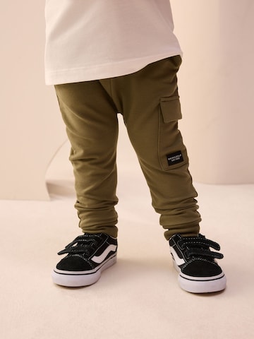 Next Tapered Trousers in Green: front