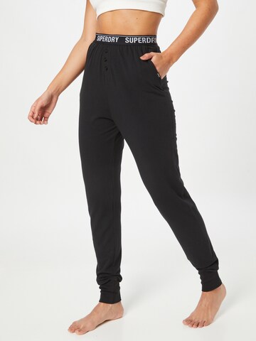 Effilé Pantalon de pyjama Superdry en noir : devant