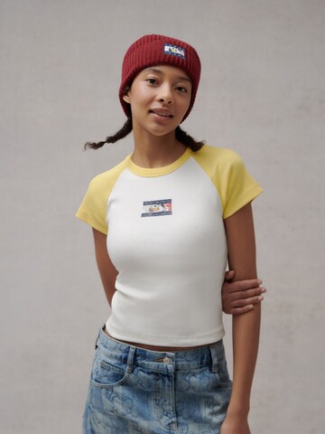 Tommy Jeans Koszulka w kolorze żółty: przód