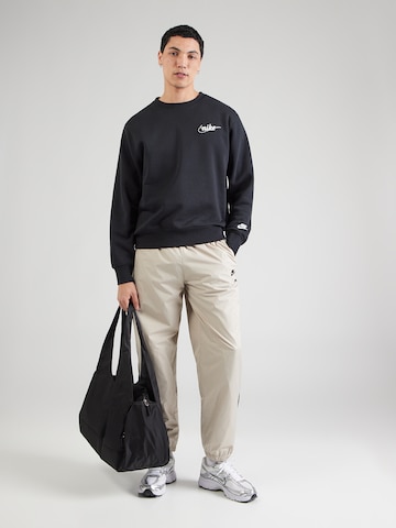 bēšs Nike Sportswear Pakapēniski sašaurināts piegriezums Bikses