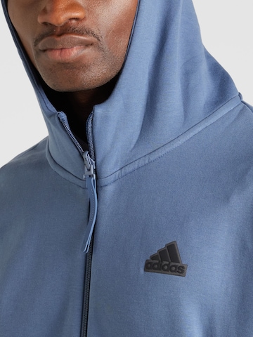 ADIDAS SPORTSWEAR Urheilullinen collegetakki 'Z.N.E. Premium' värissä sininen