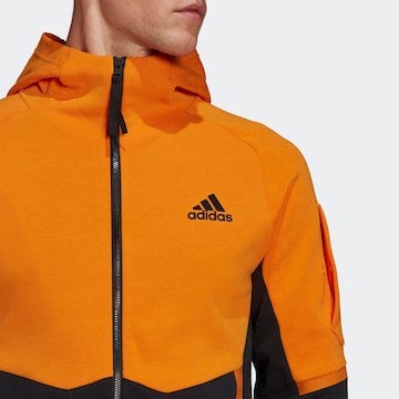 ADIDAS SPORTSWEAR - Casaco de treino em moletão em laranja