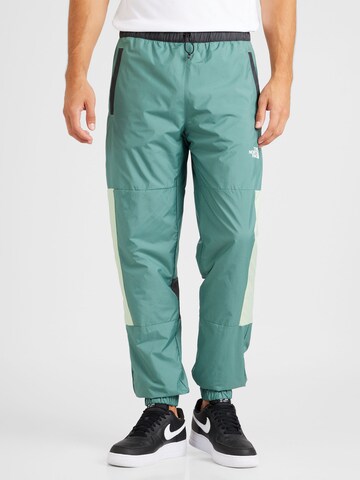 THE NORTH FACE Tapered Workout Pants in Green: front