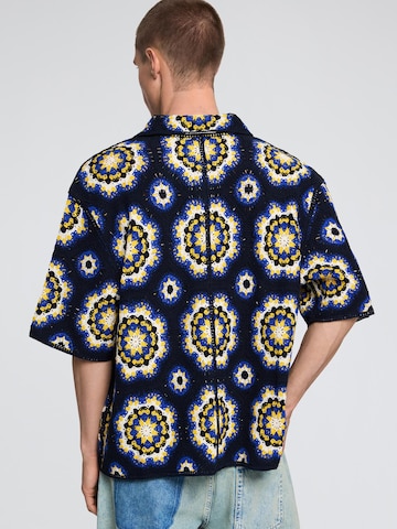 Geacă tricotată de la Desigual pe albastru