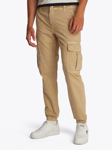 Tommy Jeans Tapered Gargohousut 'RYAN' värissä beige: etupuoli