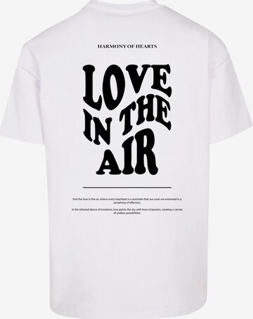 T-Shirt 'Love In The Air' Merchcode en blanc