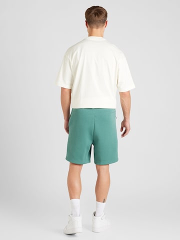 Loosefit Pantalon Nike Sportswear en vert