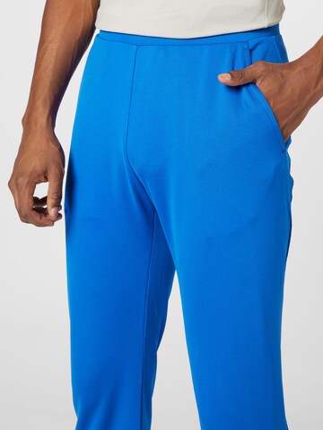 Tapered Pantaloni sportivi di J.Lindeberg in blu