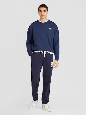 Champion Authentic Athletic Apparel Tapered Byxa 'Elastic' i blå