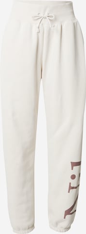 Nike Sportswear Tapered Trousers 'Phoenix' in Beige: front