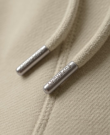 Superdry Tapered Hose 'ESSENTIAL' in Beige