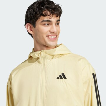 ADIDAS SPORTSWEAR Athletic Jacket 'Essentials' in Yellow