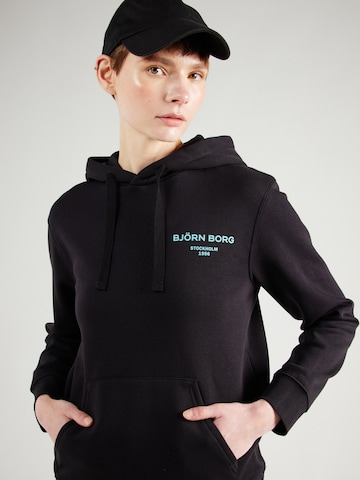 BJÖRN BORG - Sweatshirt de desporto 'ESSENTIAL' em preto