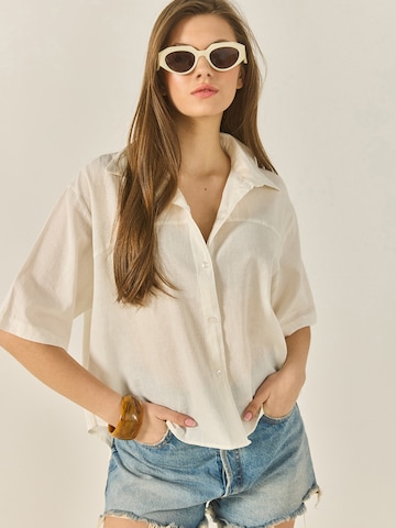 Bianco Lucci Blus i beige: framsida