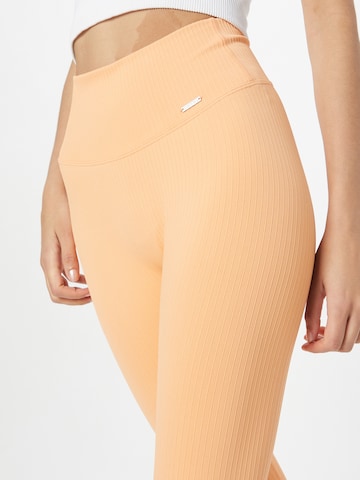 Skinny Pantaloni sportivi di aim'n in arancione