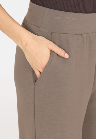 Athlecia Loose fit Sports trousers 'Jacey' in Brown