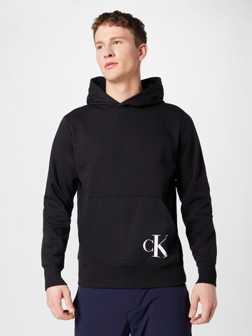 Sweat-shirt Calvin Klein Jeans en noir : devant