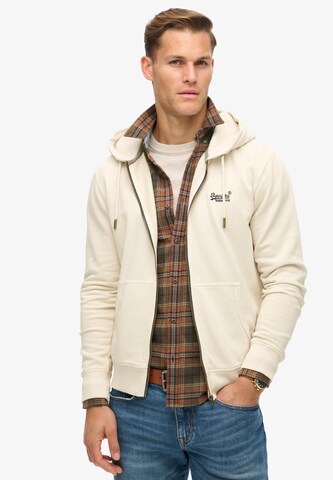 Superdry - Sudadera con cremallera 'Essential' en beige: frente