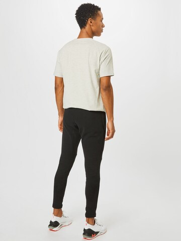 MOROTAI Tapered Sports trousers in Black