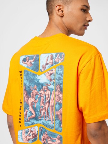 NU-IN T-shirt 'Judgement' i orange