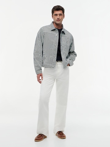 TOMMY HILFIGER Tussenjas in Blauw