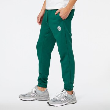 Effilé Pantalon de sport new balance en vert