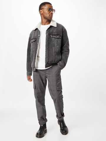 LEVI'S ® Between-Season Jacket 'Levi's® Men's Silver Tab™ Sherpa Trucker Jacket' in Black