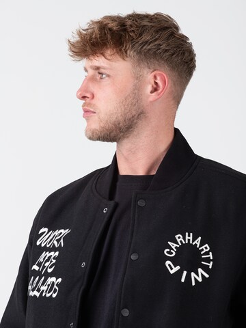 Carhartt WIP Übergangsjacke 'Work Varsity' in Schwarz
