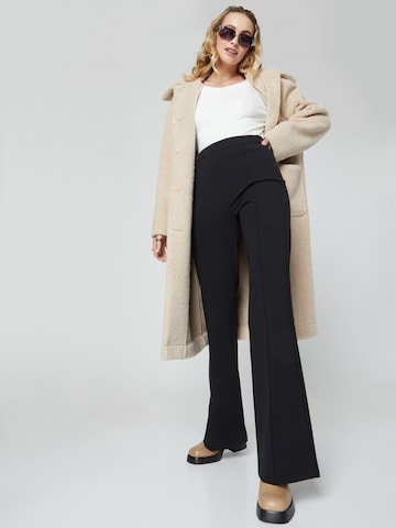 florence by mills exclusive for ABOUT YOU Flared Pants 'Spruce' in Black