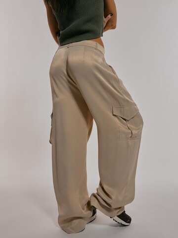 ABOUT YOU x Chiara Biasi Loose fit Pleat-front trousers 'Iris' in Beige